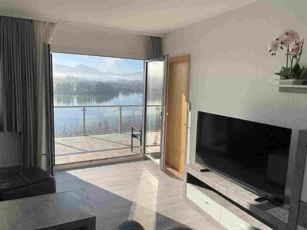 Ferienhaus Nr 35, Kategorie Komfort L, behindertenfreundlich, Feriendorf Hochbergle, Allgäu, Rezerwuj Dom wakacyjny Hotele w Bawaria z parkingiem, Parking