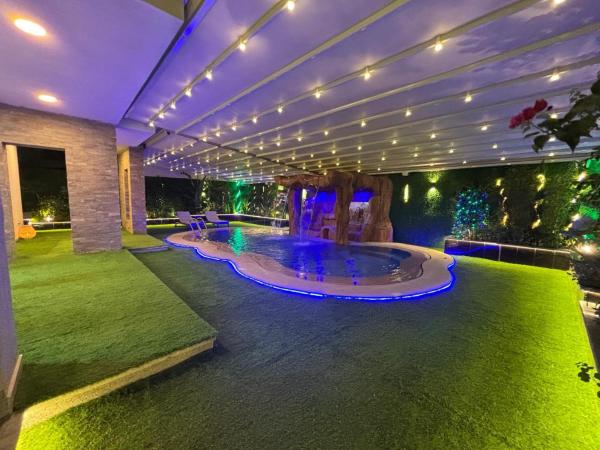 7 BR Smart House with Heated Pool, Waterfall, Garden, Rezerwuj  Kair Cairo Governorate